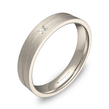 Anillo plano de 4mm en oro blanco 18k con acabado satinado y un diamante talla princesa en ranura.