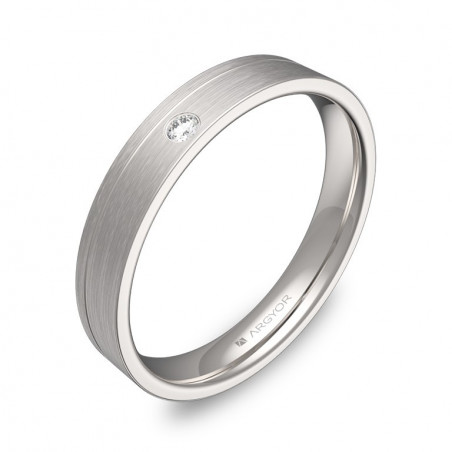 Anillo de diseño plano en oro blanco de 18k con acabado satinado y un diamante brillante en ranura.