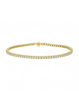 Clásica pulsera de rivière con una hilera continua de diamantes talla brillante de oro amarillo 18k