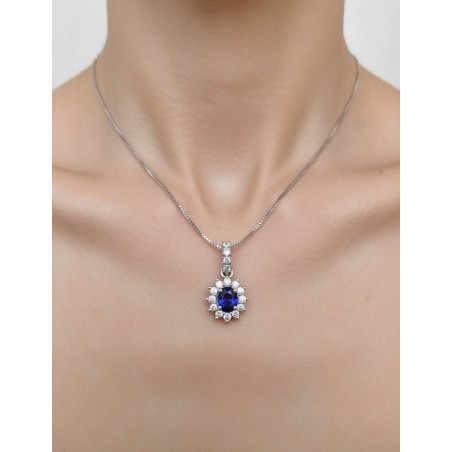 Colgante Zafiro Oval 0.50ct y 16 Diamantes. Oro Blanco 18k